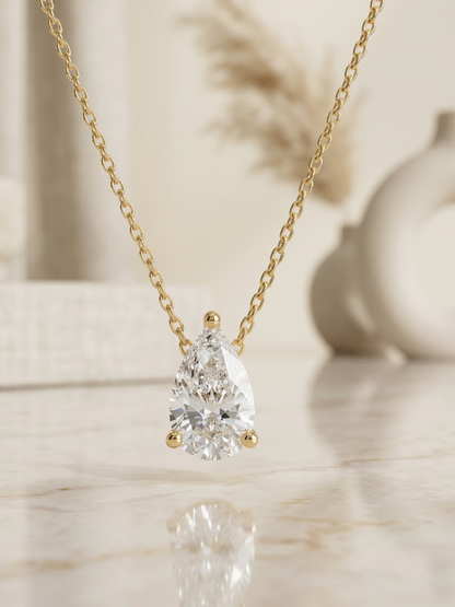 diamond solitaire pendant necklace yellow gold pear​

