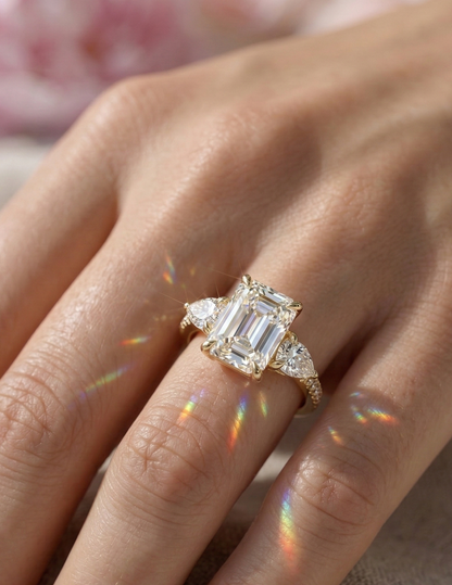 three stone emerald cut ring​

