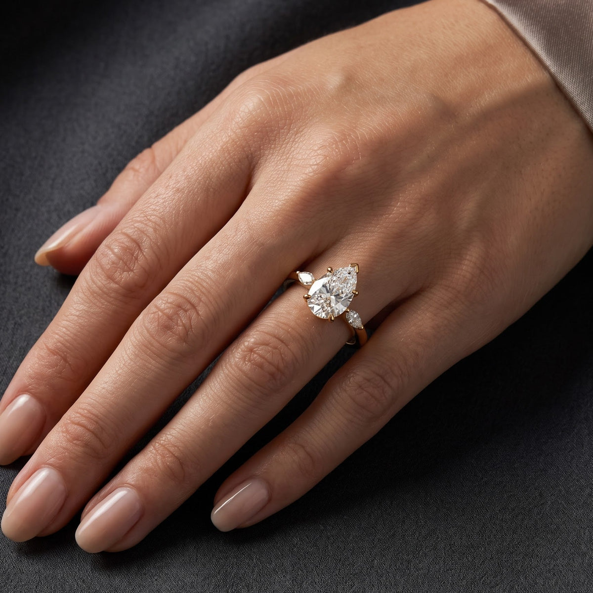 pear cut three stone bridal ring