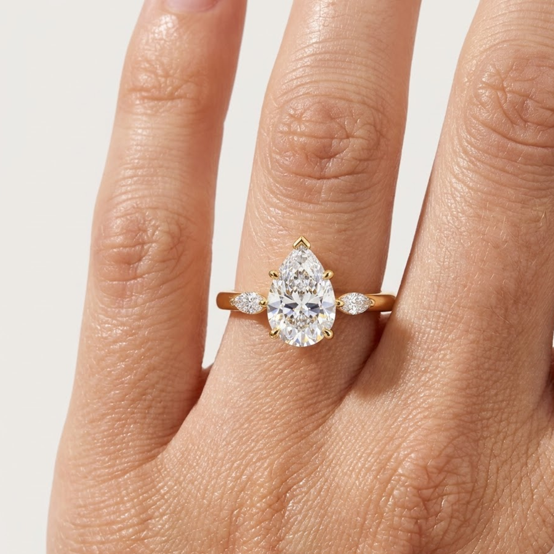 pear shaped three stone engagement ring