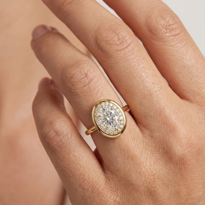 oval halo engagement rings yellow gold​

