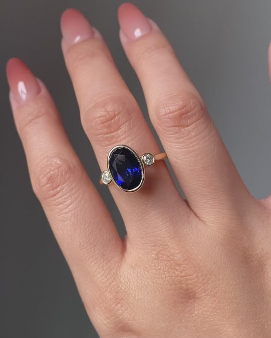 Blue Sapphire Oval Birthstone Bezel Setting Three Stone Engagement Ring