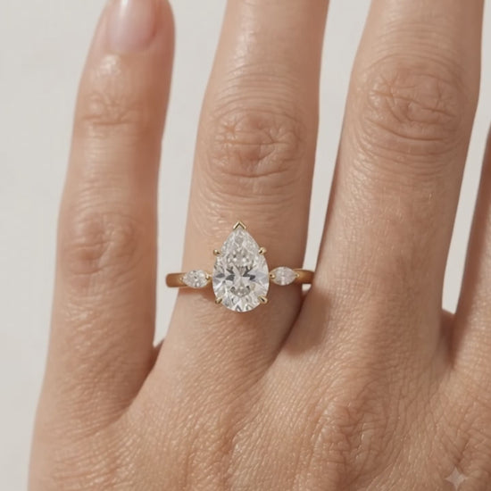 pear three stone diamond ring
