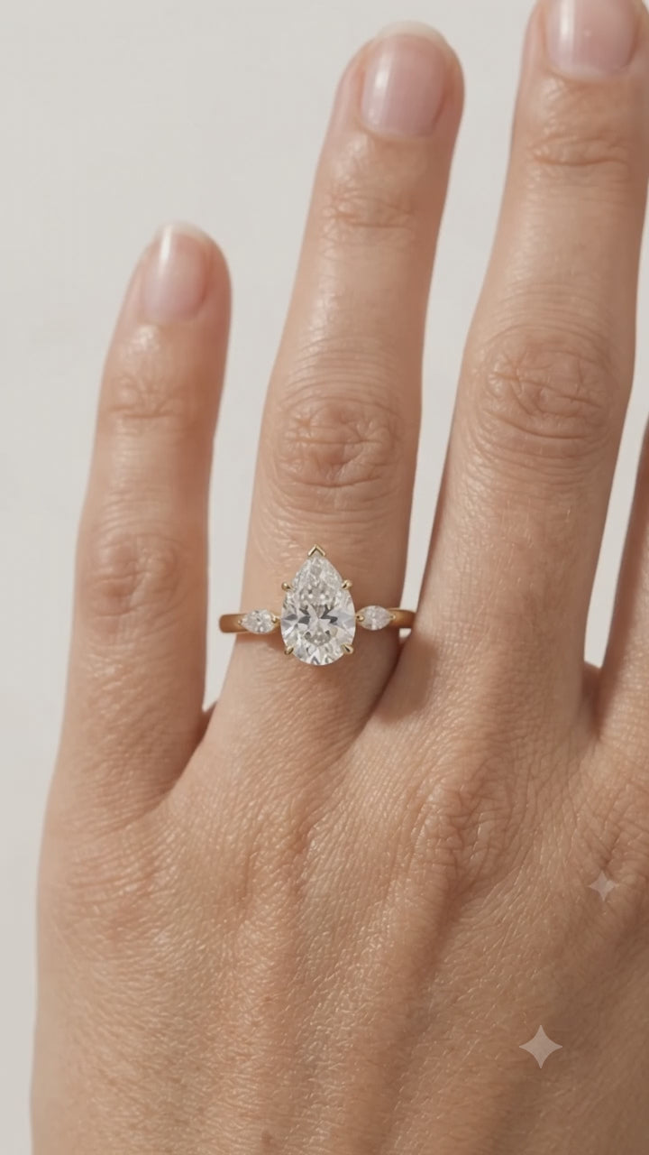 pear three stone diamond ring