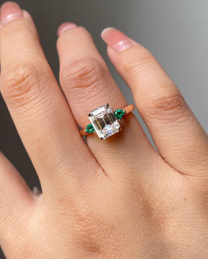 engagement rings three stone emerald cut​

