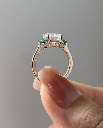 three stone ring emerald cut​

