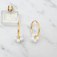 gold hoop and pearl earrings
